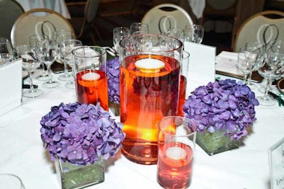 Centerpieces maintained the event's purple vineyard theme.
