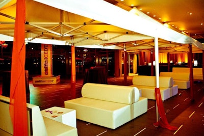 Cabanas and all-white lounge furniture provided seating areas at the shindig, and also added to the South Beach-style motif.