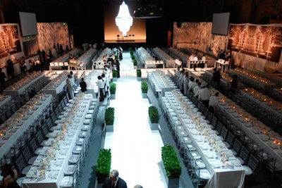 Some 600 guests sat to dinner at long, white tables.