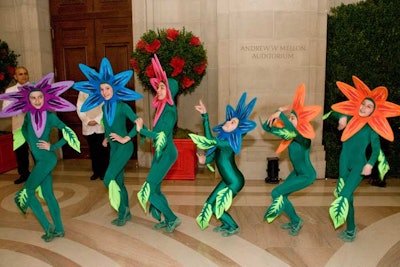 The younger members of the ballet company danced among guests during the reception dressed as flowers and piglets.