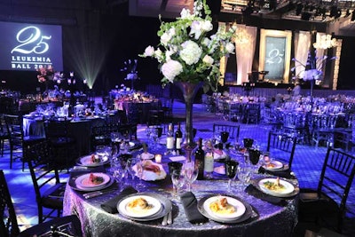 Floral arrangements with French tulips, hydrangeas, and orchids from Exquisite Design Studio topped the 175 tables.
