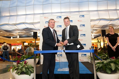 Ed Freni, director of aviation at Massport, cut the ribbon to the new shops with Dominic Lowe, Westfield's executive vice president of concession management.