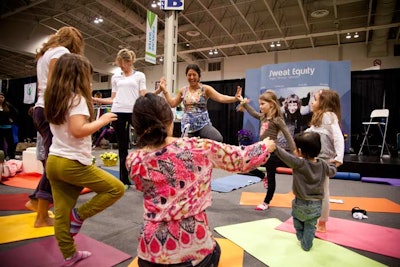 Sweat Equity Yoga taught free yoga classes on the Green Living Show floor.