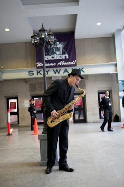 At the Canadian Jewish Political Affairs Committee's Action Party, the long, narrow Skywalk inspired a design scheme based on the look of 1920s train stations. Styled after a train platform, the exterior entrance had a saxophonist playing under an old-fashioned streetlight.
