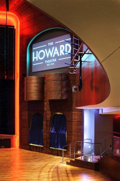 Interior architect Marshall Moya planned the black walnut walls, oak floors, and Brazilian-granite bars on each level.