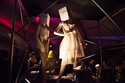 In the tent, Remer created four scaffolding towers to display garments from the school's fashion resource center. The structures were surrounded with buffet stations.