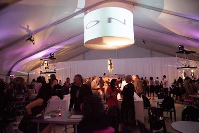 A reception took place in a Partytime Productions tent in Millennium Park. From the center of the tent, Frost designer Dennis Remer hung a 16-foot-wide video drum screen that showcased content from the school's past fashion shows.