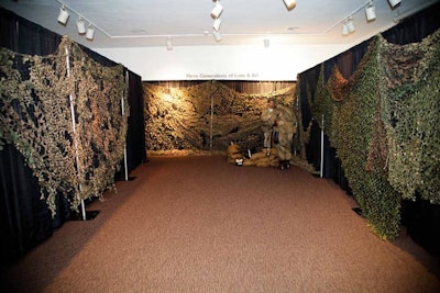 Camouflage netting served as decor and covered the venue's current art exhibition.