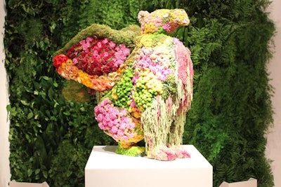 Inspired by Jeff Koons' 'Puppy' sculpture at the Guggenheim Museum Bilbao, event producer Van Wyck & Van Wyck built a four-foot-tall topiary shaped in the form of a griffin. The mythical animal is sponsor JW Marriott's logo and the floral version, which was created as a surprise for the brand executives, had eyes made of mums.
