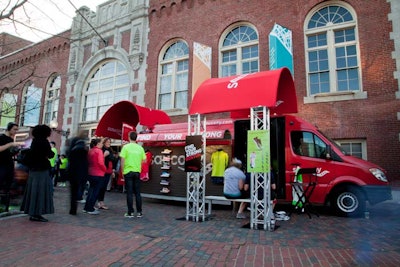 A Saucony van was positioned outside of the venue. The sides of the vehicle opened up to become display cases for the new running shoe, and a sound system playing upbeat tunes was positioned at the back of the van.