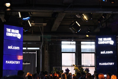 For one group, the first part of the event was a theater-style presentation in a space that had four digital towers showcasing images of AOL's different brands. The other set of attendees headed to a separate floor, where a more informal setup had bench seating and information displayed on screens placed overhead. Once each session finished, the groups switched locations.