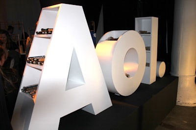 To use its logo as a functional part of the evening, AOL crafted a large, letter-shaped structure that held snacks packaged in tubes by caterer Pinch Food Design.