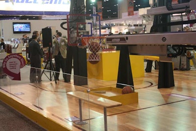 Wittman Battenfeld used basketballs throughout its exhibit to demonstrate the capabilities of its robots. The equipment moved balls from one container to another, bounced balls, and tossed them into nets. The company developed the exhibit to make a connection to the N.C.A.A. March Madness tournament, which ended Monday night.