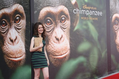 The Disney Channel's Laura Marano, from the show Austin & Ally, was one of several of the network's stars who walked the red carpet at AMC Downtown Disney for the premiere of the movie Chimpanzee. The film from Disneynature studios focuses on the life of Oscar, whose face filled the step-and-repeat.