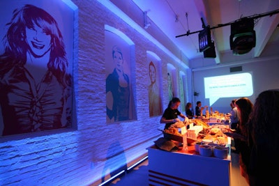 The five-color design scheme was employed in a number of decorative elements, including lounge vignettes and oversize portraits. The latter had the likeness of show stars painted in the monochromatic hues of their division, including beauty personality Tabatha Coffey in blue, fashion stylist Rachel Zoe in purple, and chef Roblé Ali in orange.