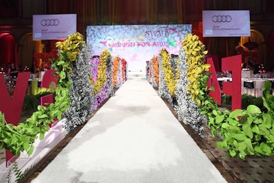 Syzygy worked with Edge Floral Event Designs to create a bridge that served as a runway across the venue's central fountain.