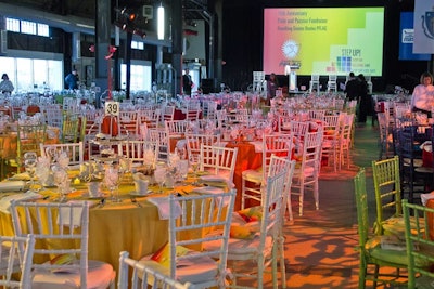 After the cocktail reception, guests moved to the third floor, where they sat at rainbow-colored 60-inch round tables. As they took their seats, they found savory cheese plates with wine pairings from The Catered Affair's executive chef Shane O'Neil. Centerpieces were towers of donated cupcakes, cookies, and pastries from local pastry chefs.