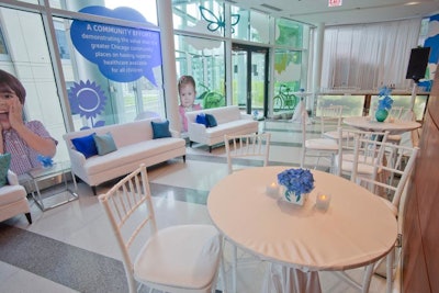 In the 11th-floor hallway, cocktail tables were decorated with Botanicals' tidy blue flower arrangements.