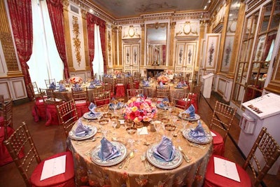 The chairs in the gilded gallery drew the room's drapes into the decor.