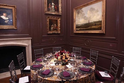The dark brown, purple, and gold of the artwork in one of the back galleries continued to the table linens and plum chair cushions.
