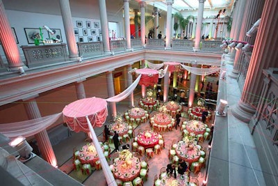 Pink fabric draping and chandeliers above the first floor complemented the colors of the linens below.