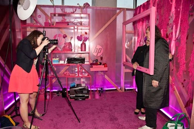 To represent magenta and show off the wireless photo-printing capabilities of its product line, a pink-colored section invited guests to pose with props behind a pink picture frame. In addition to printing the pics on-site, the booth sent digital versions to guests.