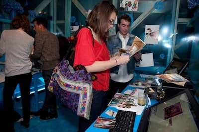 The booths served more than a decorative purpose, with a specific activity for attendees in each space. The cyan booth offered a timed experiment where guests were invited to create storyboards by cutting images and graphics from magazines or using HP TouchSmart computers and printers.