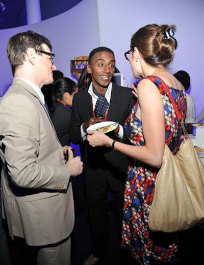 Also dubbed a 'celebrity igniter' by Syfy was chef Marcus Samuelsson (pictured, center), who curated the menu for the event. Pinch Food Design executed the concept, which included passed plates, a station where staffers created chocolate bites, and a curious set up that saw pretzel balls shoot into plates mounted atop light fixtures.
