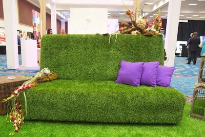 AFR Event Furnishings' Green Grass line includes sofas, benches, and a bar covered in artificial turf. The pieces make an eye-catching display for outdoor events.