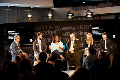 The second area of the event saw a less formal show, with panelists sitting on a small stage. The backdrop for the platform was equipped with two LED screens and several other screens hung from the ceiling throughout the space.