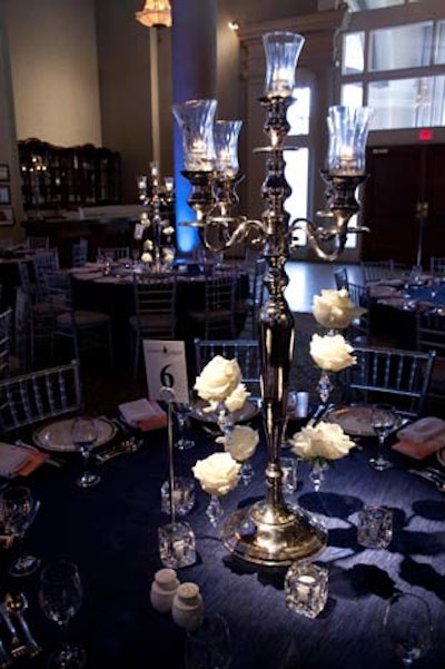 White roses and crystals dangled from candelabra, forming the centrepieces for the dinner tables.