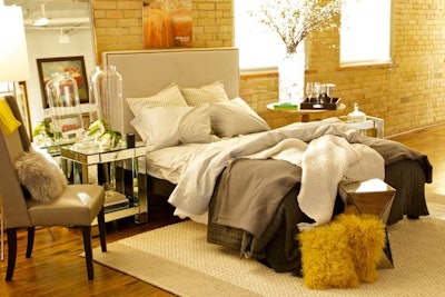 A bedroom display, designed by Jessica Kelly Design, was the focal point of the party and doubled as the photo backdrop.