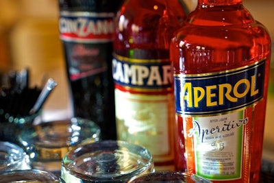 Bartenders mixed cocktails with Italian spirits. Guests sipped on drinks like the Aperol Betty, with aperol, orange juice, and grapefruit juice.