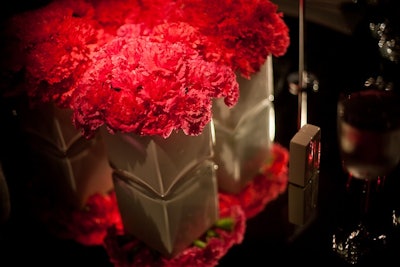 Torpedo Factory, tightly packed fuchsia carnations in white vases.