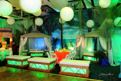 Sail away to tropical paradise with palm trees and cabanas.