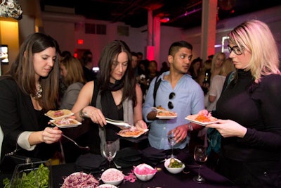 At the P&L Catering launch party, guests dressed their own tacos with cilantro, red cabbage slaw, white onion, pickled onion, hot peppers, and radish at a station.