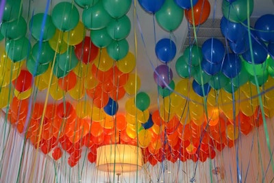 The entrance hallway was filled with rainbow-hued balloons that underscored the evening's cause. 'We wanted to provide a fun and memorable backdrop to a giant party celebrating both the theater and the queer community,' said development manager Biz Wells.