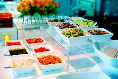 There were a number of customizable toppings at a taco station; a similar spread was set up at a mac and cheese station.