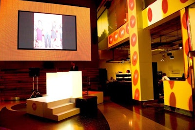 Other design elements included a custom DJ booth and wall projections, which hit white beams in the Atrium, giving it an angular, geometric look. Photos from an on-site photo booth flashed on the screen.