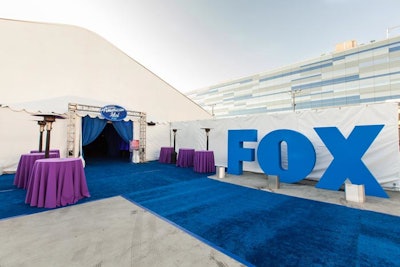 Giant letters spelled out 'Fox' at the entrance to the party tent.