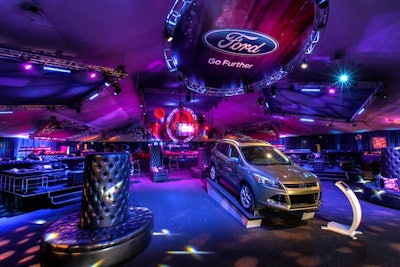 A Ford vehicle stood sentry at the entrance to the party space.