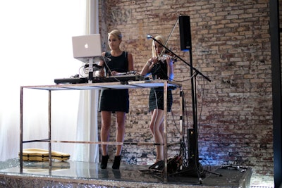 For entertainment, the intimate affair saw a DJ set by a female duo from S.C.E. Event Group. The women stood on an elevated stage, which was covered with a silver sequin material.