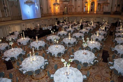 Dinner took place in the State ballroom. At the front of the space, a large drop-down screen played a tribute video that showcased the work of the women's board.