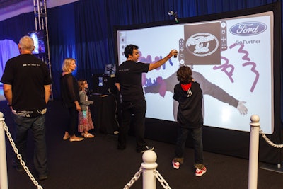 Ford sponsored two interactive graffiti walls, photo ops that allowed guests to choose from various stencils and colors, while using virtual spray cans to decorate their photos before printing or uploading to the Web.
