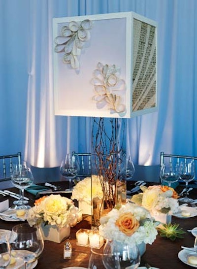 Thin strips of paper were twisted into flowery shapes on the centerpiece lamps.