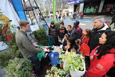 The setting also included a garden, where GrowNYC could speak about its 'Grow to Learn' program. Honest Tea's vice president of marketing, Peter Kaye (pictured, far right), said the patch of greenery displayed in Times Square will be donated to PS 102.