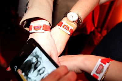 Guests wore R.F.I.D.-enabled bracelets that allowed them to share photos and thoughts about the event on social networking sites such as Facebook.
