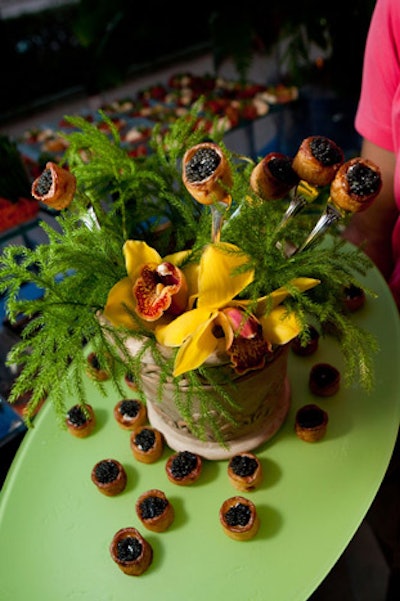 Reception hors d'oeuvres included caviar bites. The luxury summit program included speakers representing luxury brands in fashion, beauty, automotive, spirits, and financial services, as well as journalists and political commentators.