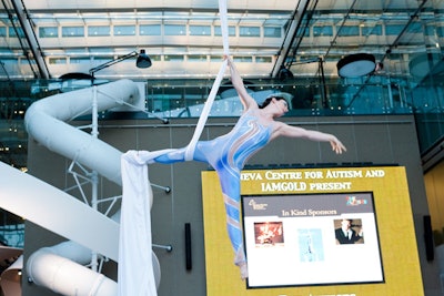 For its third annual Autists Gala, the Geneva Centre redesigned the event, scrapping the live auction in favour of entertainment like Zero Gravity Circus, which had an aerialist perform in the atrium at Corus Entertainment.