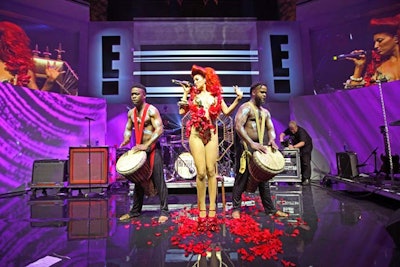 The flame-haired, British singer Neon Hitch performed her newest single 'Love U Betta,' accompanied onstage by two male bass drummers. As guests mingled around the space, staffers invited them one of the venue's front rooms, where they could have their photo taken by E!'s signature GlamCam 360.